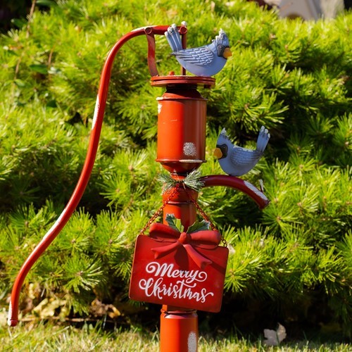 Old Style Red Iron Water Pump with "Merry Christmas" Sign and Birds